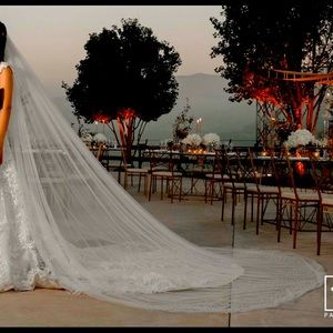 Extended cathedral train veil with pearls scattered all around